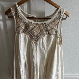 Gorgeous Free People Tank with open ties in back.